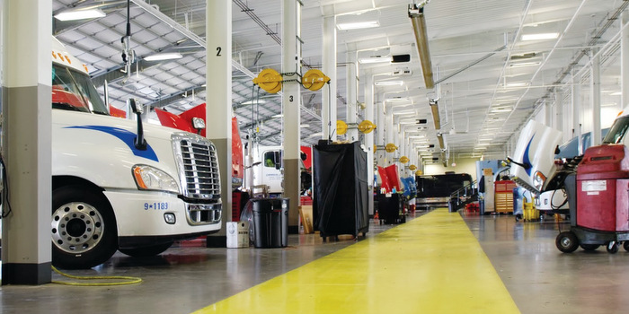 HDA Truck Pride Technicians in a Garage